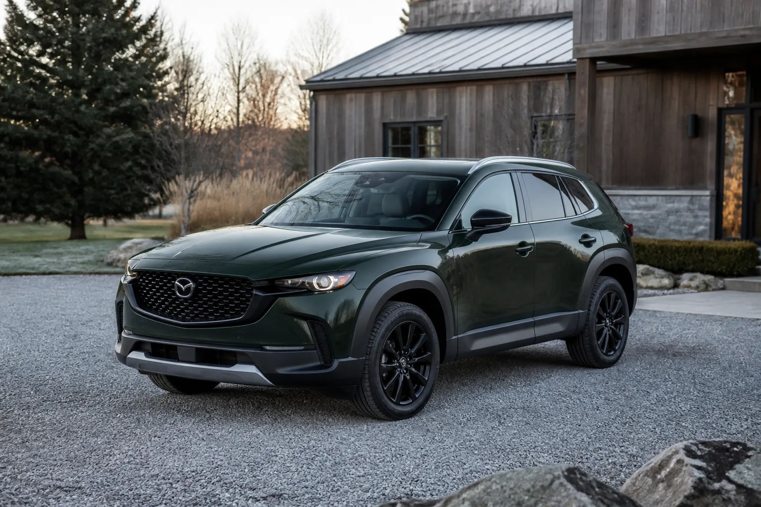 Illustrative forest green crossover outside a modern lodge