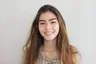 Sofia M., a young woman in a taupe top